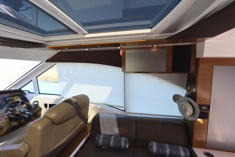 Slide: The Image of Interior of 2015 Cruisers Cantius yacht with leather seating and modern design elements. - 46
