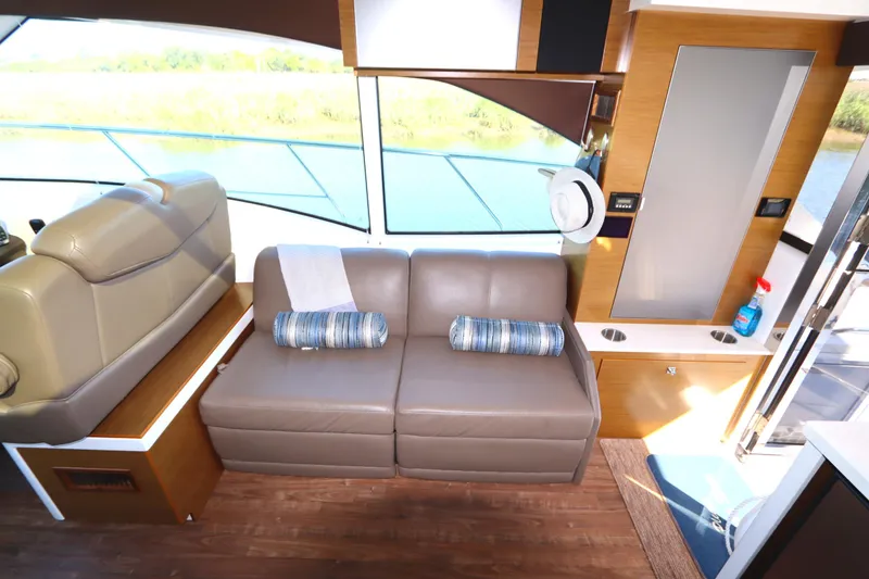 Slide: The Image of 2015 Cruisers Cantius yacht interior with leather seating and modern design. - 38