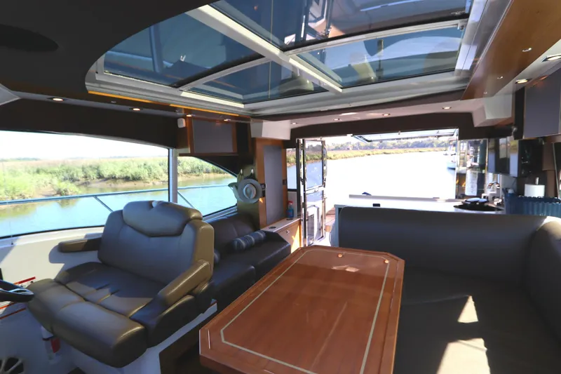 Slide: The Image of Interior of 2015 Cruisers Cantius yacht with luxurious seating and panoramic windows. - 41