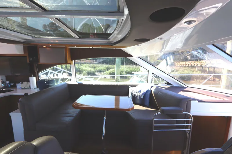 Slide: The Image of Interior of a 2015 Cruisers Cantius yacht with sleek seating and panoramic windows. - 43