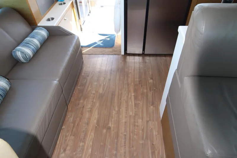 Slide: The Image of 2015 Cruisers Cantius interior with leather seating and wood flooring. - 44
