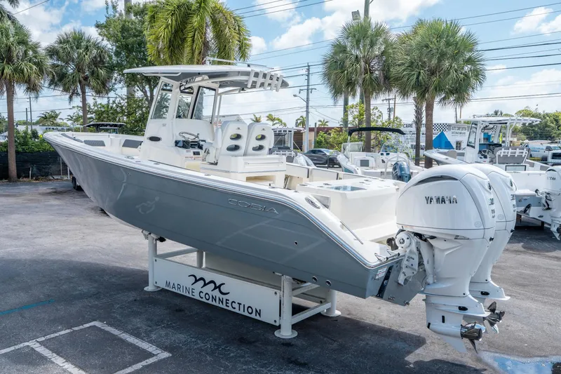 Slide: The Image of 2025 Cobia 285 CC boat with Yamaha engines displayed at Marine Connection. - 4