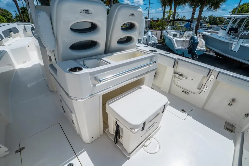 Slide: The Image of 2025 Cobia 285 CC boat interior with seating and storage compartments. - 15