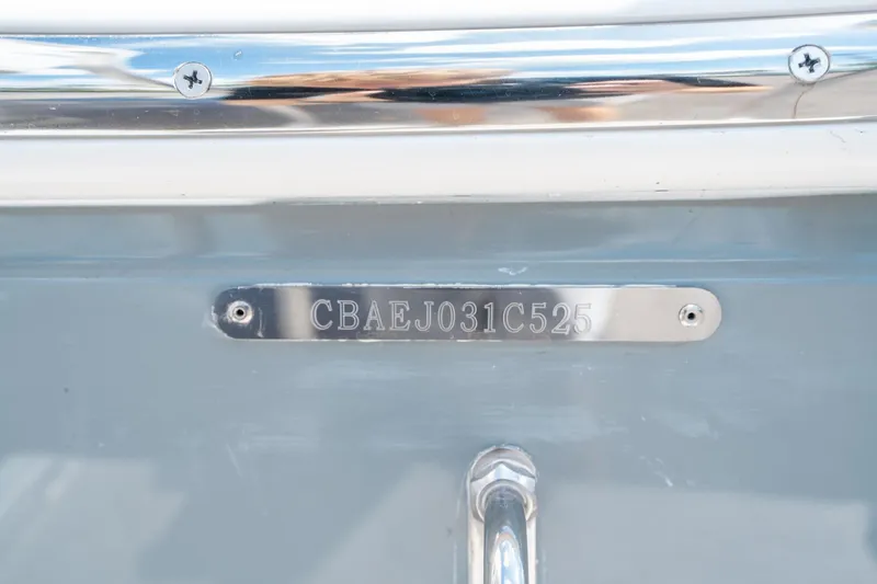 Slide: The Image of 2025 Cobia 285 CC boat hull identification number plate. - 38
