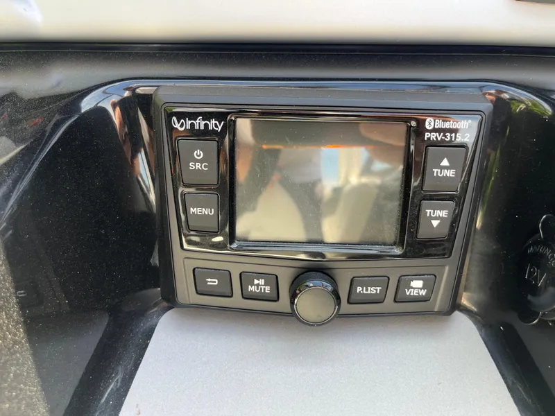 Slide: The Image of Infinity Bluetooth stereo system on 2022 Yamaha Boats AR210 dashboard. - 18