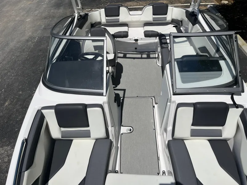Slide: The Image of 2022 Yamaha Boats AR210 interior with sleek seating and open cockpit design. - 22