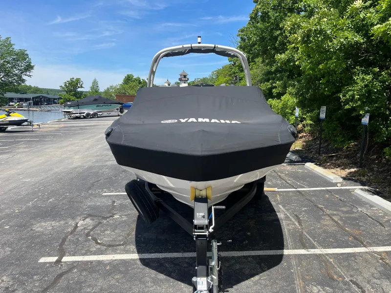 Slide: The Image of 2022 Yamaha AR210 boat with cover in parking lot near water. - 30