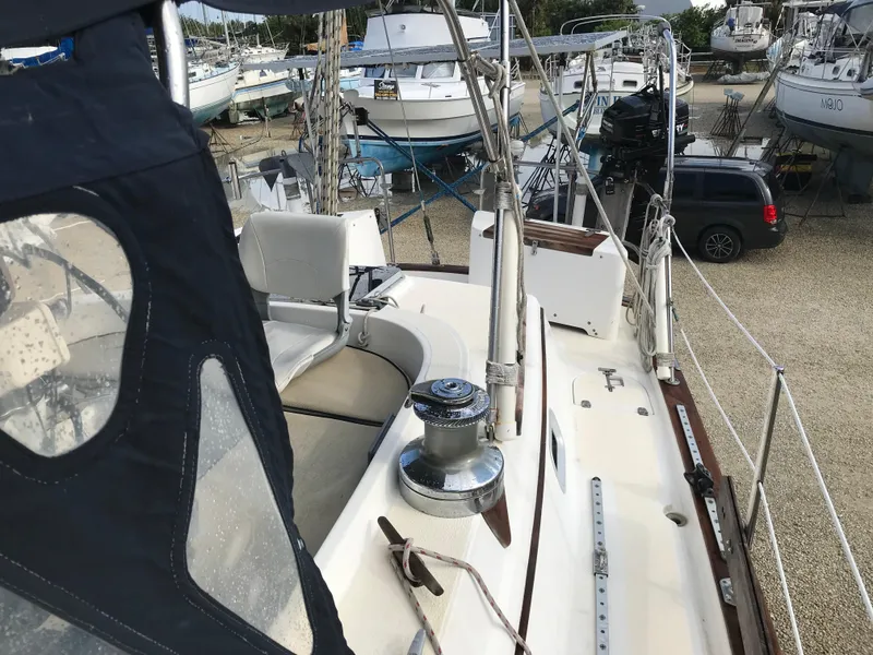 Slide: The Image of 1990 Endeavour 38 CC sailboat deck view in a marina setting. - 14