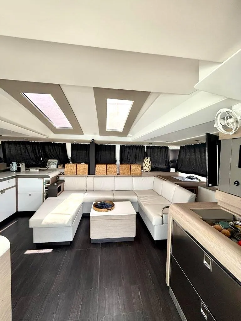 Slide: The Image of Luxurious interior of 2022 Fountaine Pajot Elba 45 catamaran with modern furnishings and skylights. - 22