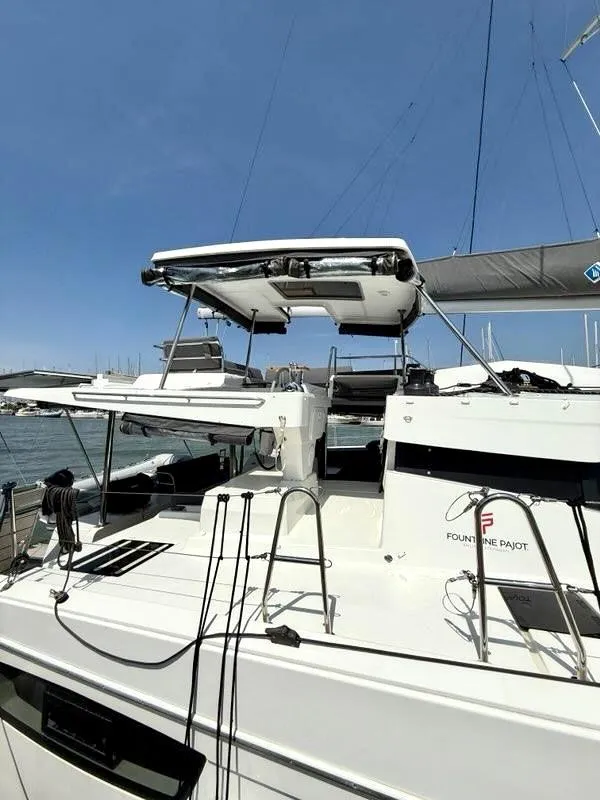 Slide: The Image of 2022 Fountaine Pajot Elba 45 catamaran docked, showcasing sleek design and modern features. - 7