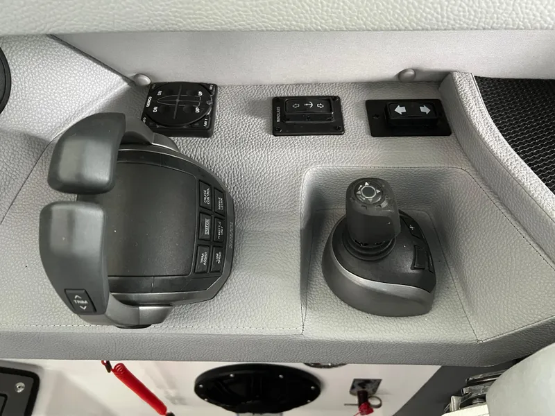 Slide: The Image of Control panel of 2022 Cobalt A36BR boat with joystick and throttle controls. - 20