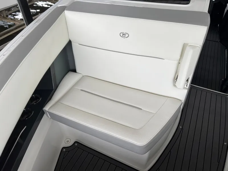 Slide: The Image of 2022 Cobalt A36BR boat interior seating with white and gray upholstery. - 23
