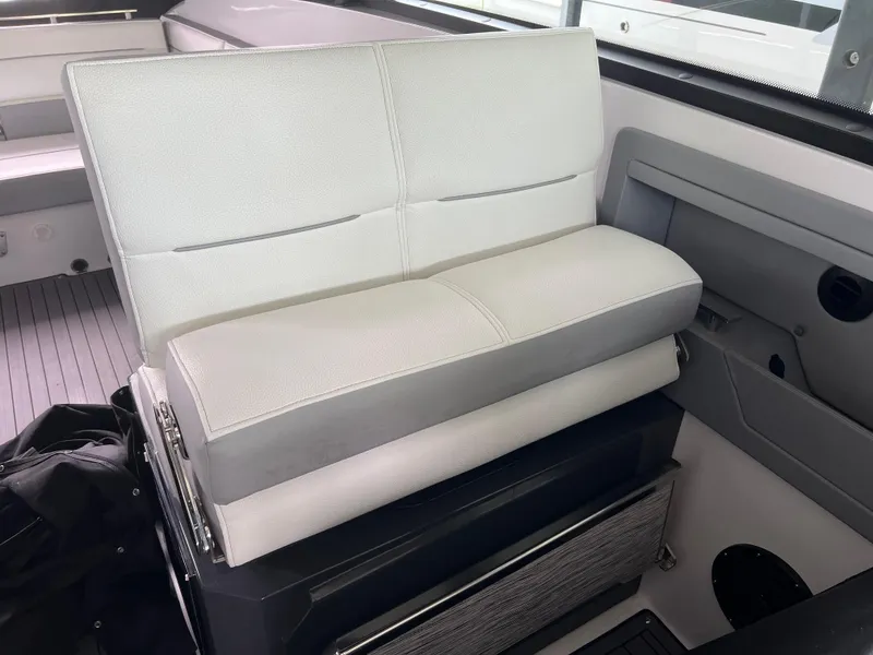 Slide: The Image of 2022 Cobalt A36BR boat interior with white cushioned seating and modern design. - 25