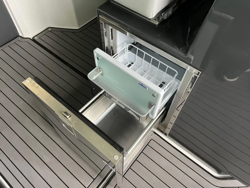 Slide: The Image of Open drawer refrigerator on 2022 Cobalt A36BR boat deck. - 28