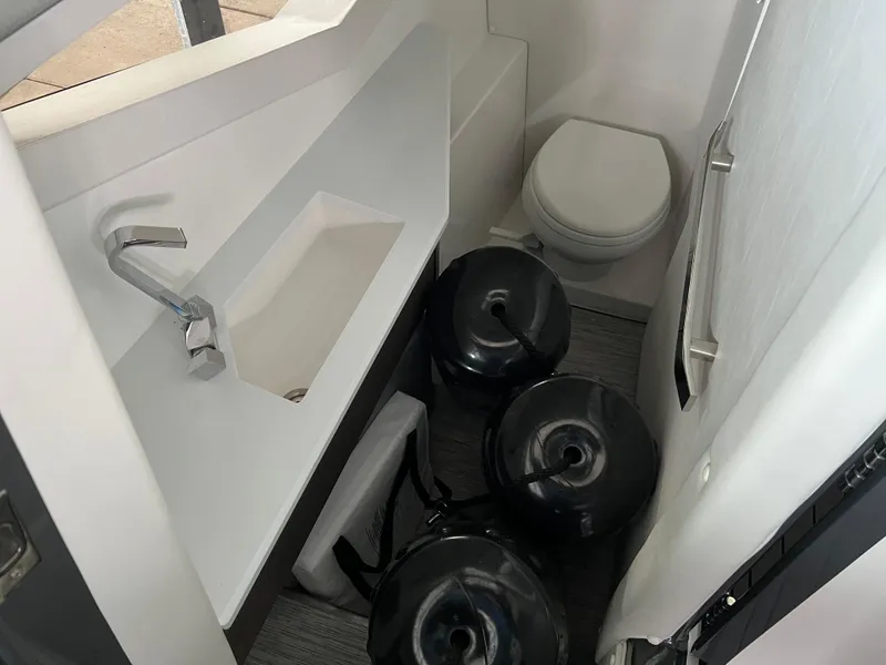Slide: The Image of 2022 Cobalt A36BR boat bathroom with sink, toilet, and storage space. - 30