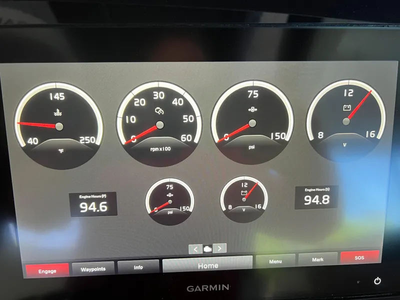 Slide: The Image of Dashboard display of a 2022 Cobalt A36BR boat with various gauges and readings. - 34