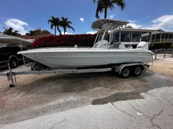 The Image of 2024 ALK2 Powerboats 25 CRX on trailer, parked outdoors under clear sky. - 1