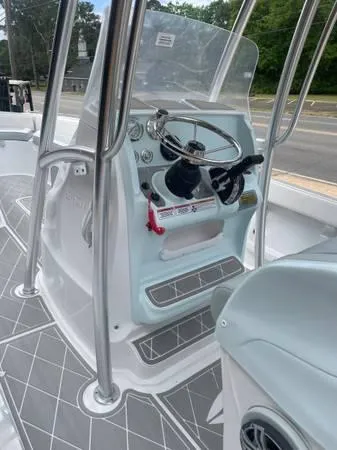 Slide: The Image of 2024 ALK2 Powerboats 25 CRX console with steering wheel and controls. - 11