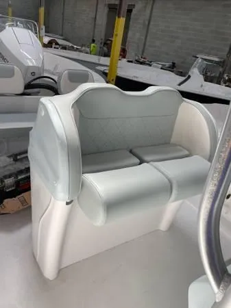 Slide: The Image of 2024 ALK2 Powerboats 25 CRX interior seating, white leather upholstery, modern design. - 12