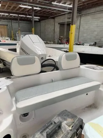 Slide: The Image of 2024 ALK2 Powerboats 25 CRX in a workshop, featuring a sleek interior and powerful engine. - 15