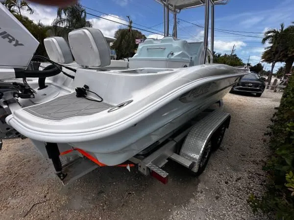 Slide: The Image of 2024 ALK2 Powerboats 25 CRX on trailer, sleek design, outdoor setting. - 4