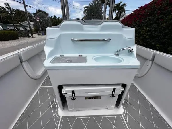 Slide: The Image of 2024 ALK2 Powerboats 25 CRX interior with sink and storage, featuring modern design elements. - 5