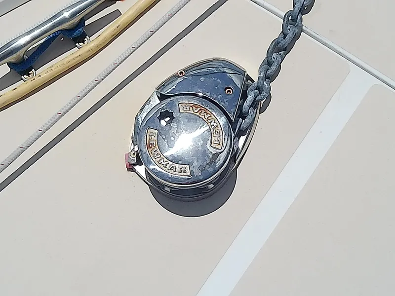 Slide: The Image of 2004 J Boats J/32 sailboat cockpit with covered wheel, docked in marina. - 18