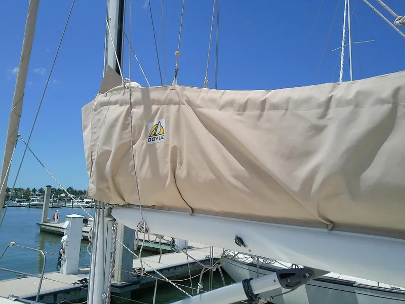 Slide: The Image of 2004 J Boats J/32 sailboat with beige canopy docked at marina. - 19