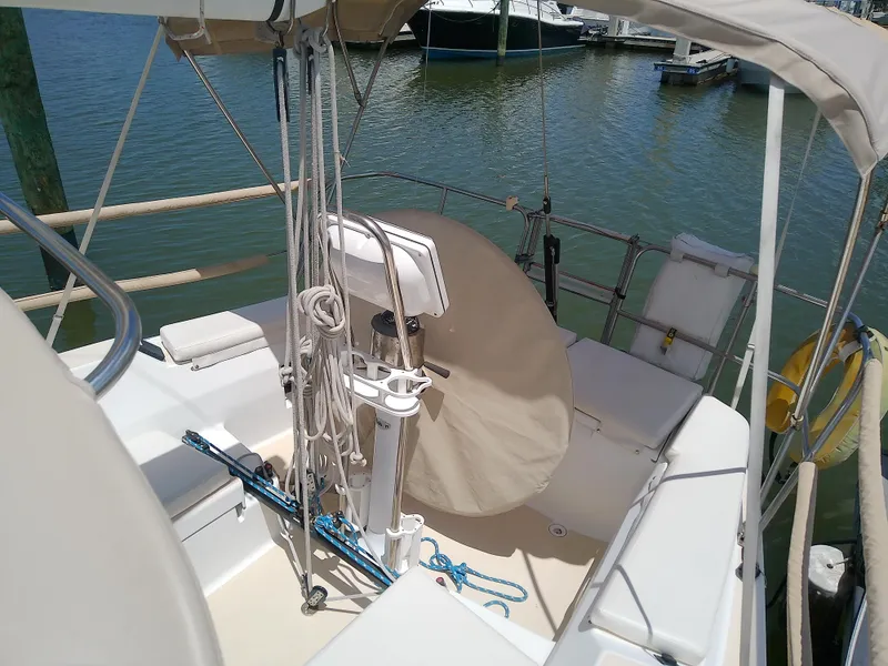 Slide: The Image of 2004 J Boats J/32 sailboat docked at marina under clear blue sky. - 22