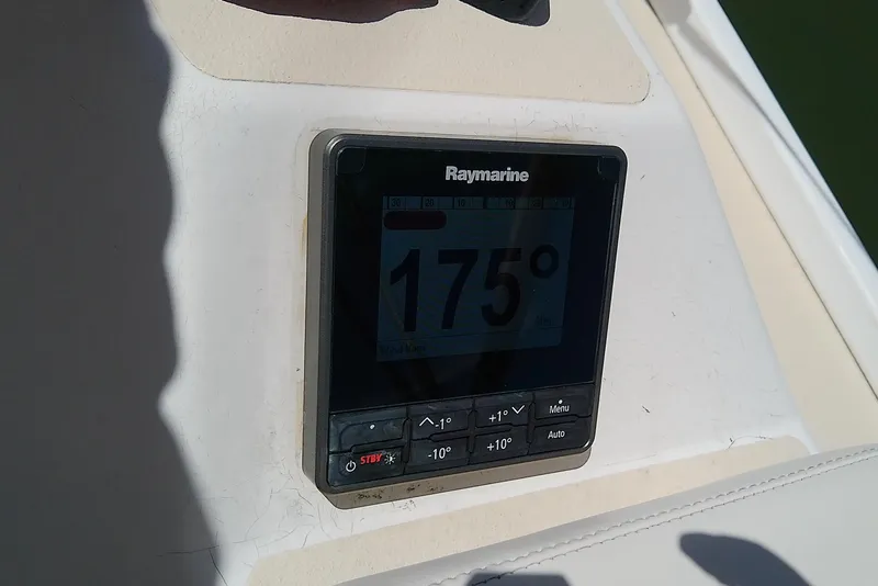 Slide: The Image of Compass on 2004 J Boats J/32 sailboat, surrounded by ropes and nautical equipment. - 38