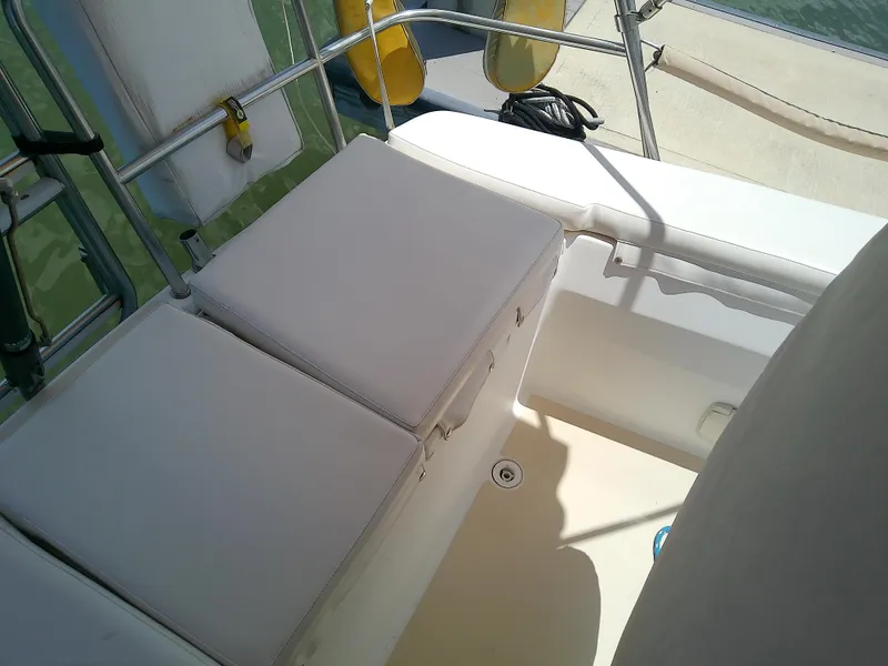 Slide: The Image of 2004 J Boats J/32 sailboat cockpit with cushioned seating and railing. - 42