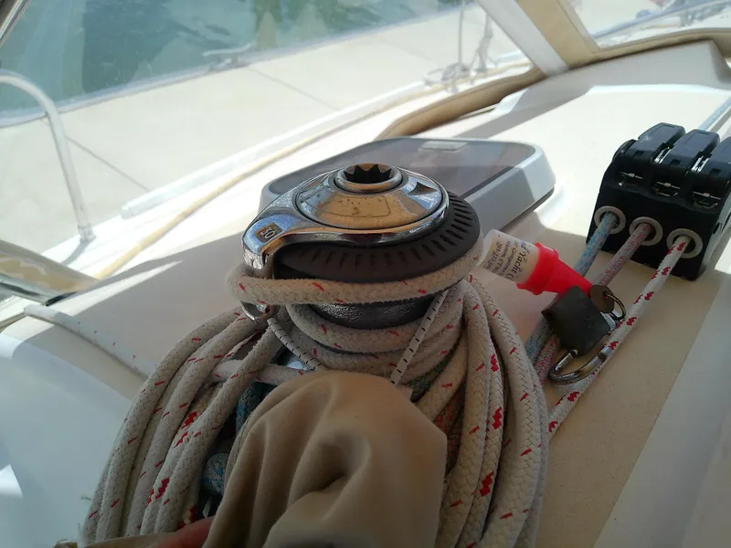 Slide: The Image of Cam cleat on 2004 J Boats J/32 sailboat deck with ropes. - 47