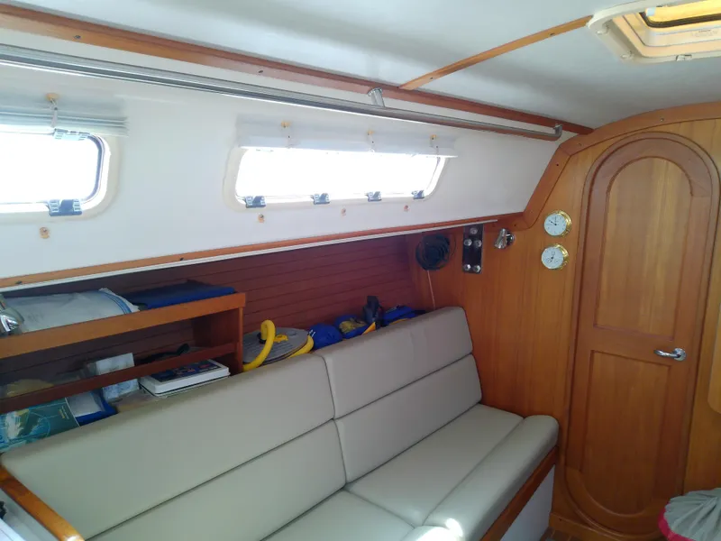 Slide: The Image of Navigation station on a 2004 J Boats J/32, featuring charts and control panels. - 55