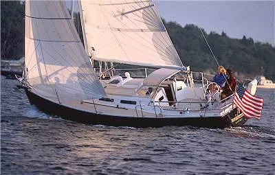 Slide: The Image of 2004 J Boats J/32 sailboat on stands, clear sky background. - 87