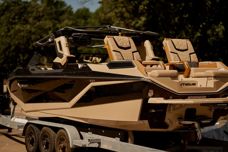 Slide: The Image of 2025 Nautique Super Air Nautique G25 Paragon boat on trailer, side view. - 7