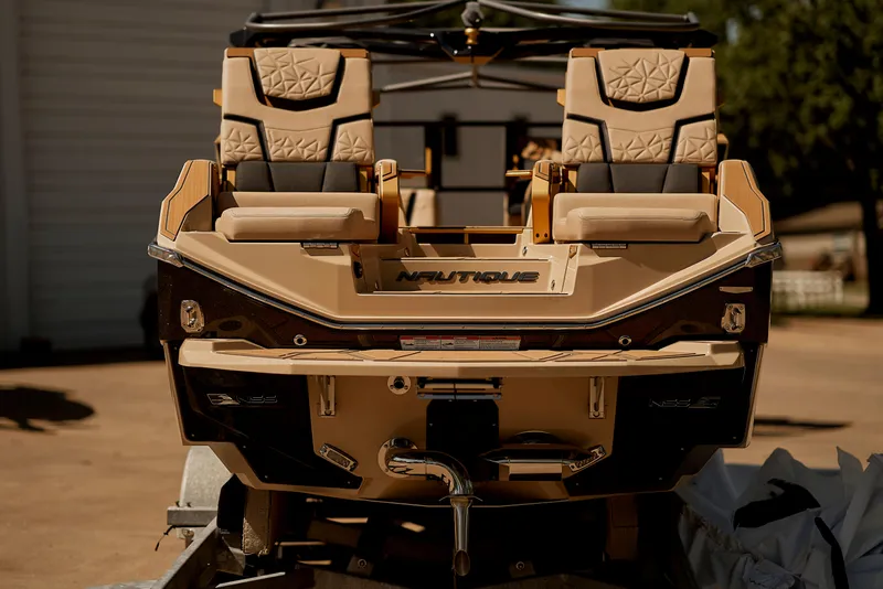 Slide: The Image of 2025 Nautique Super Air Nautique G25 Paragon boat, rear view, luxurious seating. - 8