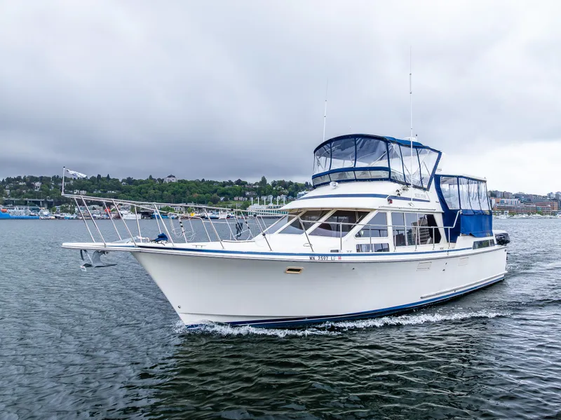 Slide: The Image of 1988 Tollycraft 44 CPMY yacht cruising on a cloudy day. - 2
