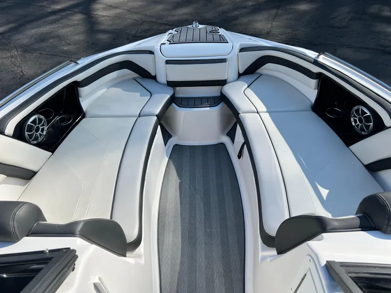 Slide: The Image of 2019 Yamaha Boats 242 Limited S interior with spacious seating and sleek design. - 10