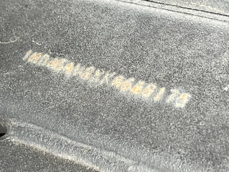 Slide: The Image of Close-up of a Yamaha Boats 2019 242 Limited S serial number on a textured surface. - 18