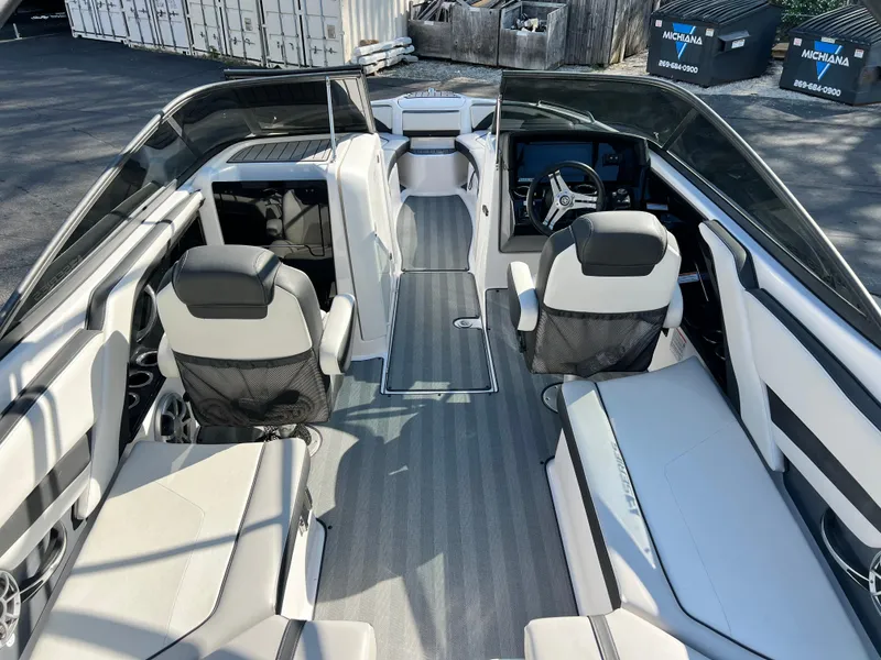 Slide: The Image of 2019 Yamaha Boats 242 Limited S interior with sleek seating and modern dashboard. - 5