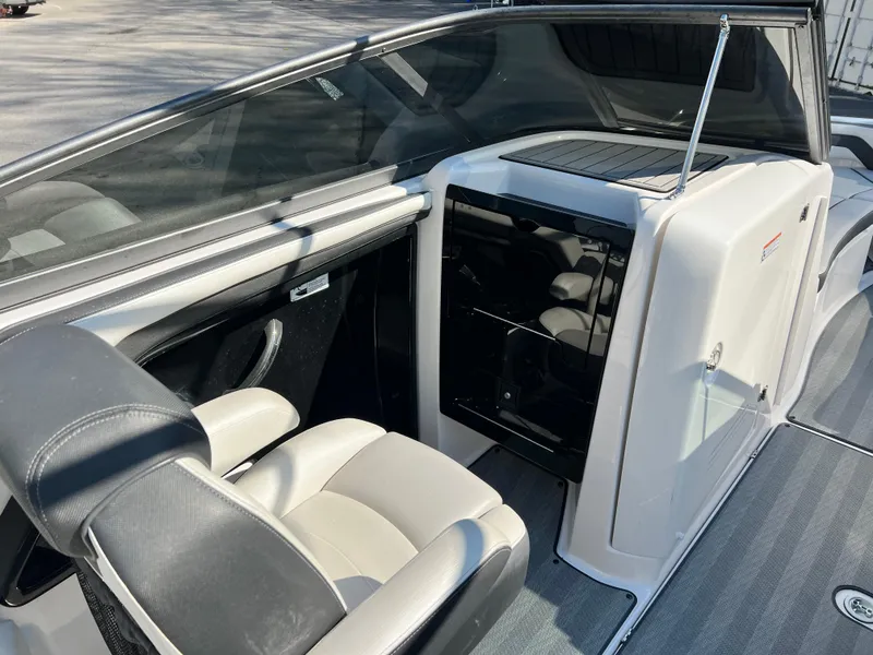 Slide: The Image of 2019 Yamaha Boats 242 Limited S interior with sleek seating and modern dashboard. - 7