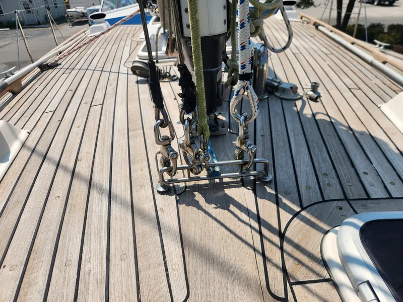 Slide: The Image of Deck of 2003 Hallberg-Rassy 46 sailboat with rigging and teak wood finish. - 12