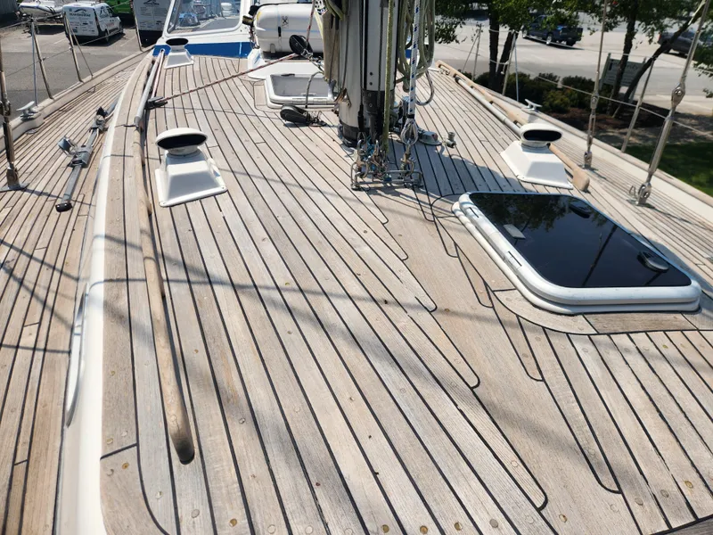 Slide: The Image of Deck of 2003 Hallberg-Rassy 46 sailboat with teak wood finish and hatch. - 13