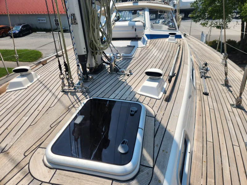 Slide: The Image of Deck of 2003 Hallberg-Rassy 46 sailboat with teak finish and rigging details. - 14