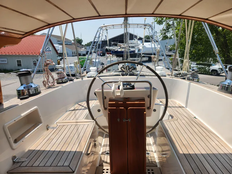 Slide: The Image of Cockpit of 2003 Hallberg-Rassy 46 yacht with steering wheel and wooden details. - 24