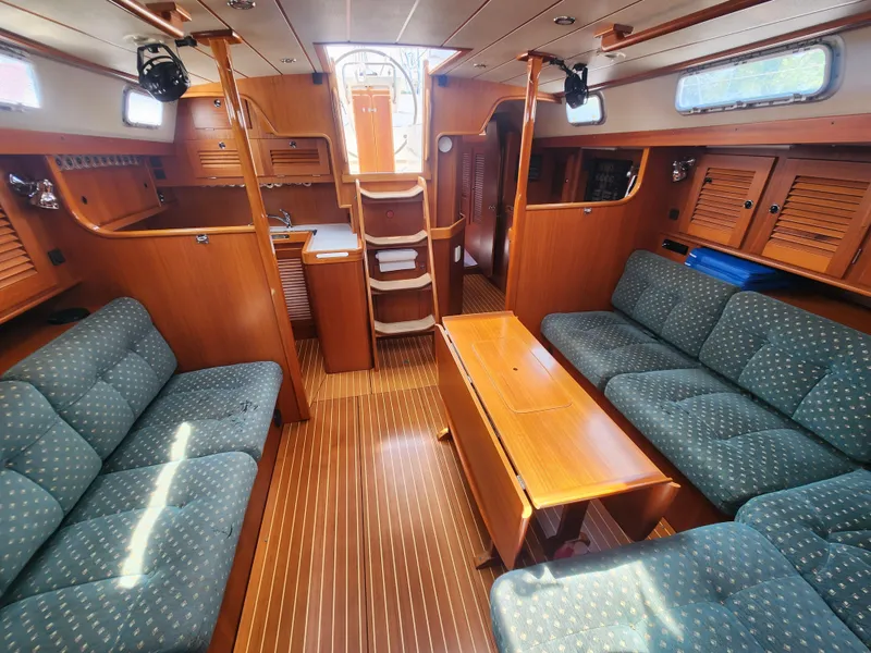 Slide: The Image of Spacious interior of 2003 Hallberg-Rassy 46 yacht with wooden finishes and comfortable seating. - 31