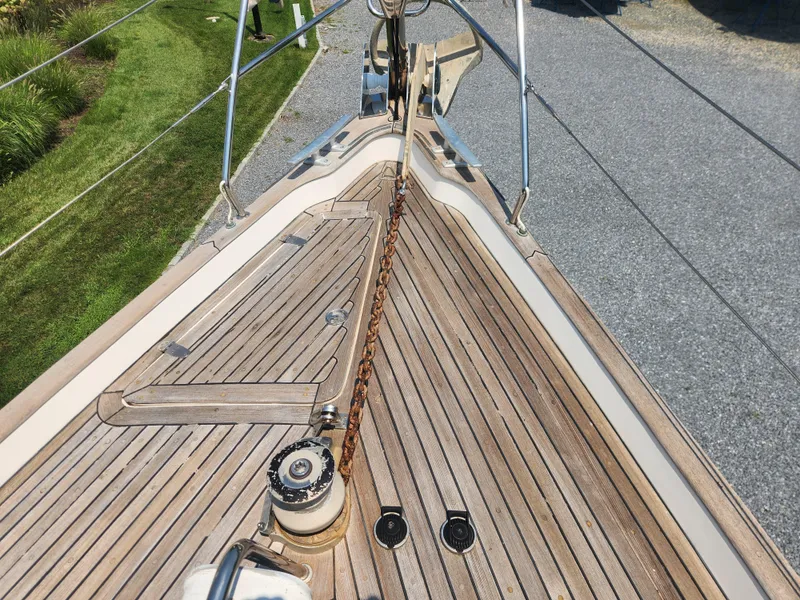 Slide: The Image of Deck of 2003 Hallberg-Rassy 46 sailboat with anchor chain and winch. - 7
