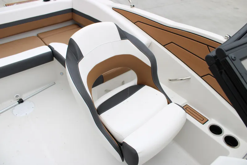 Slide: The Image of 2024 Starcraft SVX 210 OB DC boat interior with modern seating and sleek design. - 9