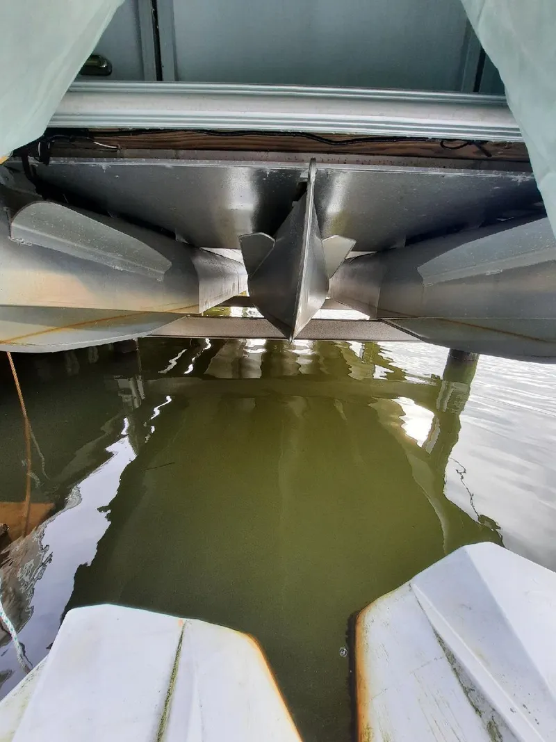 Slide: The Image of Underneath view of 2015 Sylvan Mirage Cruise 8520 CR pontoon boat in water. - 4