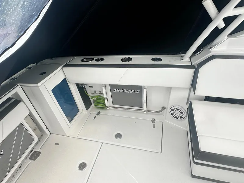 Slide: The Image of 2020 Blackfin 272 DC boat interior with seating and storage compartments. - 11